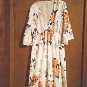 A sexy white floral v neck dress